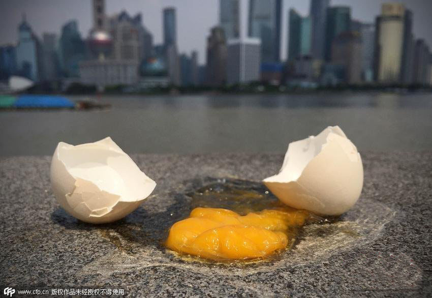 上海气温直逼四十度 外滩地面可煎鸡蛋